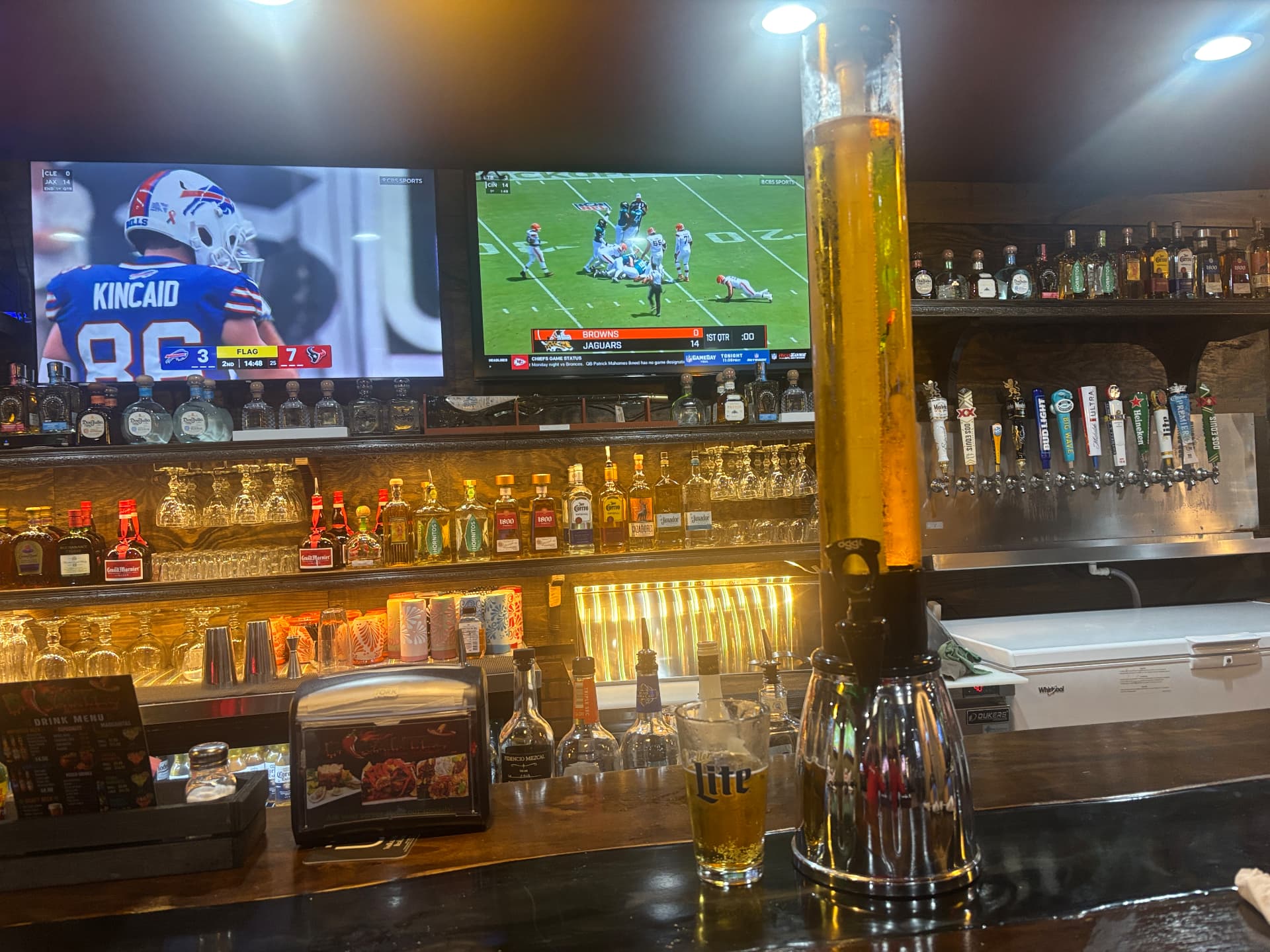 Pikantes 2 bar with a full beer tower and TVs showing NFL football on Sundays