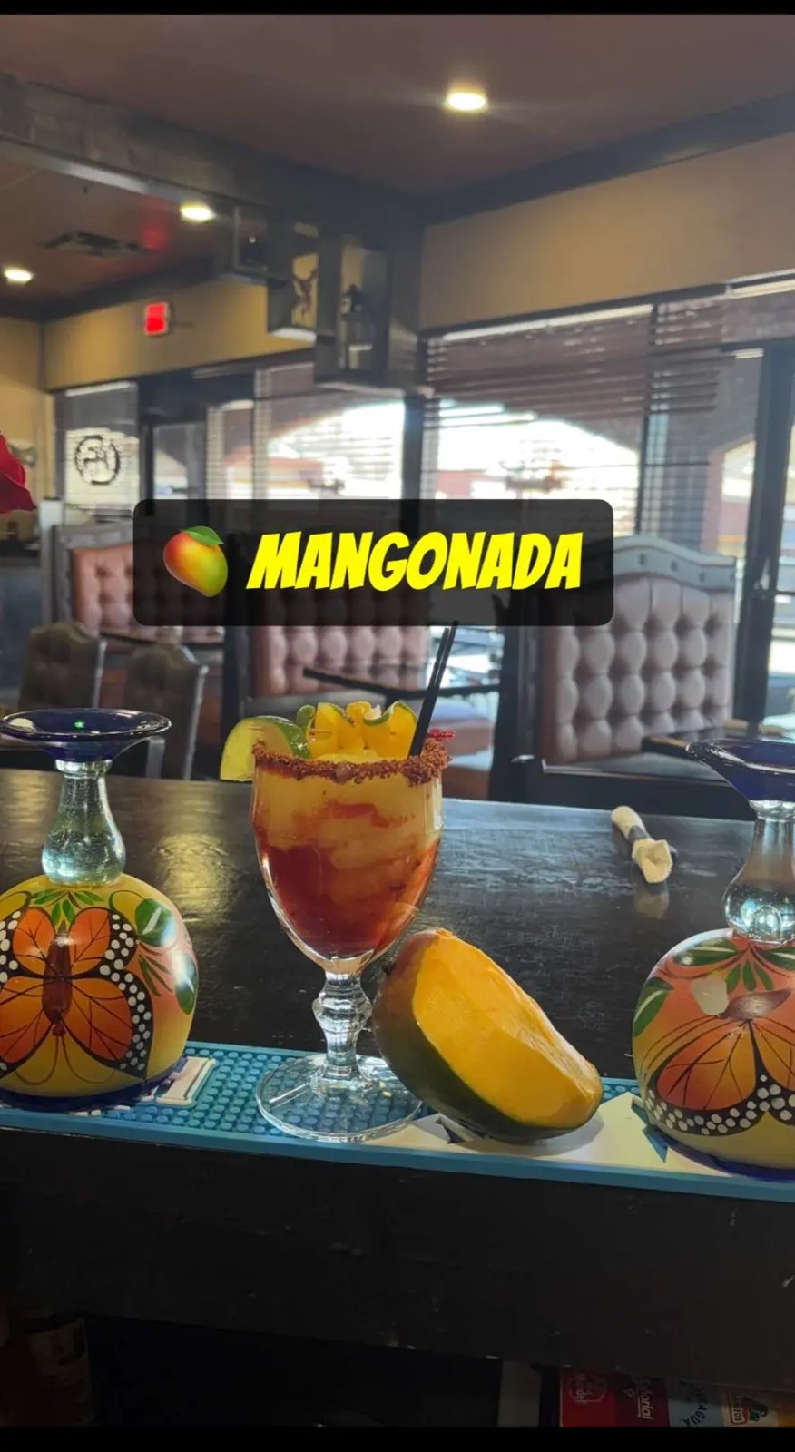 Mangonada with fresh mango, chamoy and chili rim served in a tall glass