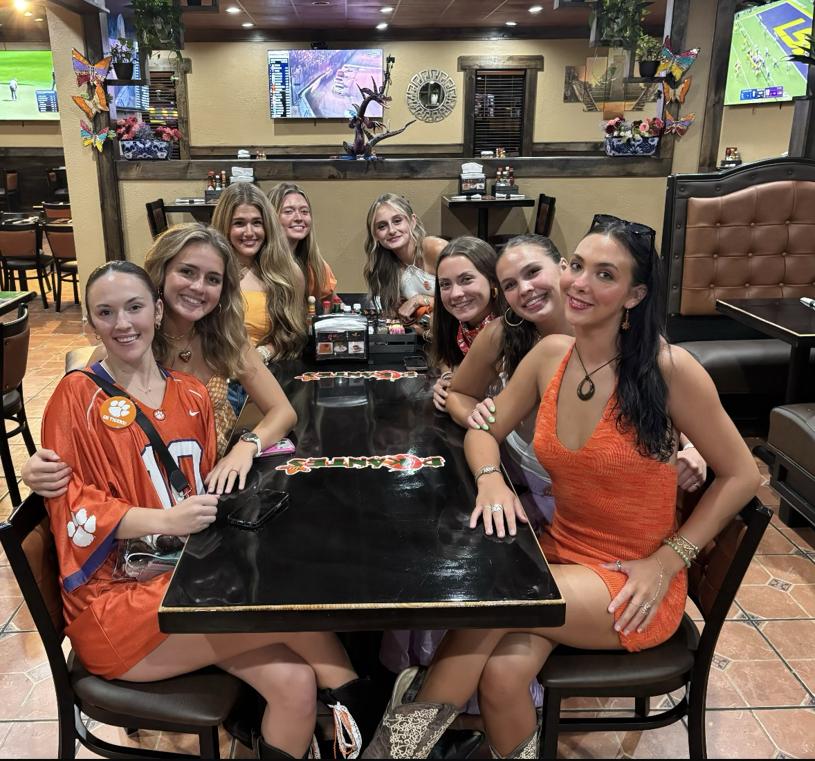 Clemson Tigers fans gathered around a table at Pikantes 2